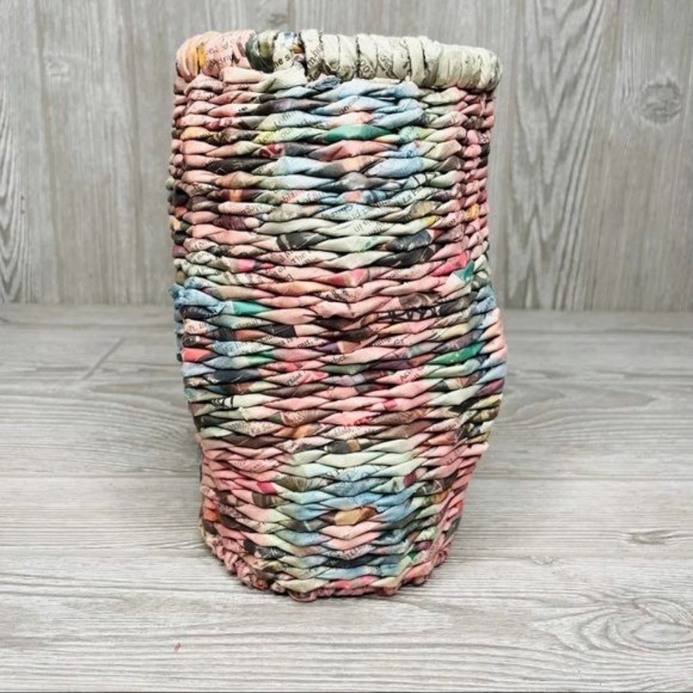 Recycled news paper vase jar decoration that has been dyed many colors